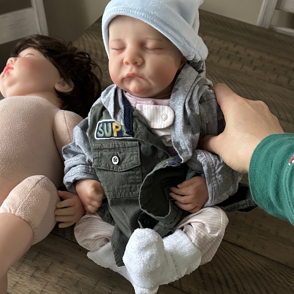 Realistic Baby Doll with Gray Outfit